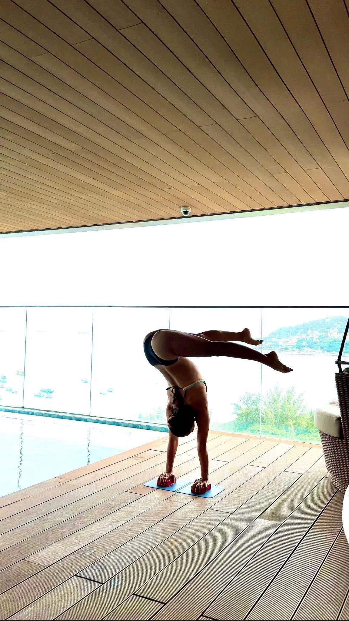 Handstand by infinity pool